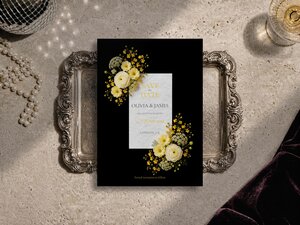 Butter yellow floral save the date template of  ranunculus, white roses and Queen Anne’s lace shown on a grey surface with editorial flower artwork, pearl necklace and silver tray.