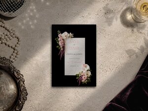 Blush pink floral save the date featuring blush pink roses, white phalaenopsis orchids, magnolia blooms, Queen Anne's lace and cascading amaranthus on a dramatic black background.