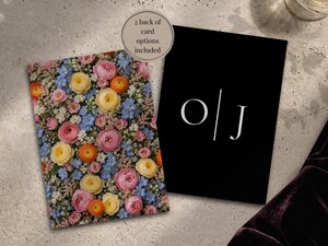 Two wedding invitation cards shown on a textured surface, one featuring a dense pattern of colorful flowers and the other black with white monogram initials separated by a vertical line.