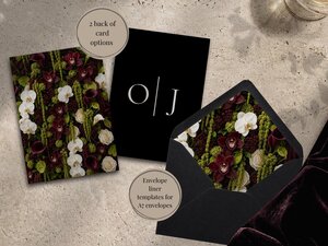 A card with dark floral print, a black card with the initials O and J, and an open black envelope with floral lining on a textured surface.