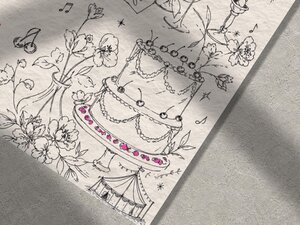Detailed close-up of the illustrated wedding cake and floral sketches on textured paper.