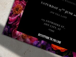 A close-up view of the black and purple floral corner on a gothic wedding invitation template.