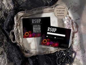 Two RSVP cards with black backgrounds and floral accents resting inside an ornate vintage silver tray alongside black lace and pearls.