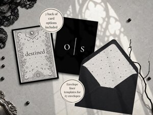 A wedding stationery display featuring a tarot card back design, a monogram card, and a black envelope with a star-patterned liner.