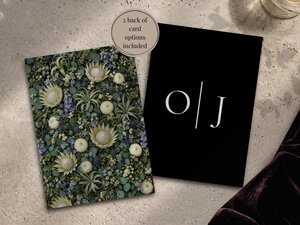 Two cards showing back design options, one featuring a dense floral pattern and the other a black card with initials O and J.