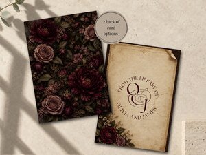 Two cards showing card back options, one with a dark floral pattern and the other with a library-style monogram and vintage floral border.