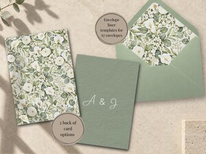 Envelope liner, a green card back, and an open sage green envelope showing a floral pattern are arranged flat on a stone background.