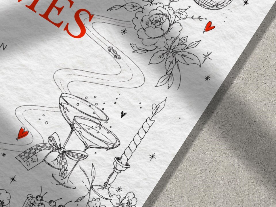 A close-up of the bottom right corner of a white wedding invitation card, showing black line art of champagne glasses, a candle, and flowers.