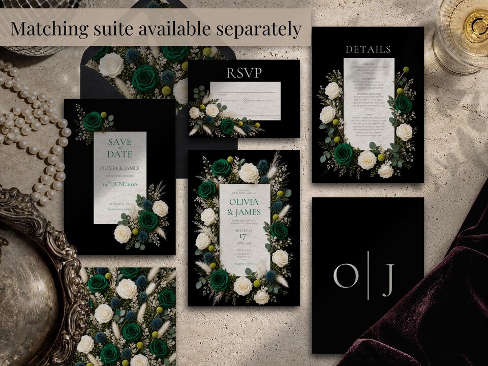 An arrangement of matching wedding stationery pieces includes save the date, RSVP, details cards, and envelopes.