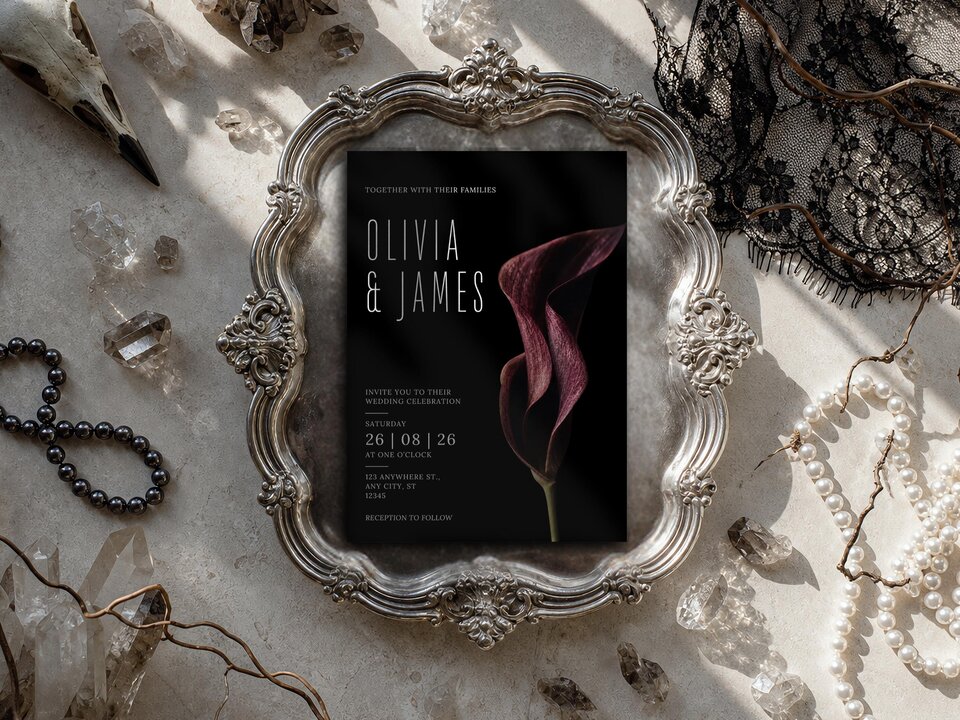 Burgundy calla lily wedding invitation with dramatic floral artwork, elegant typography and a luxury dark editorial aesthetic on a black background.