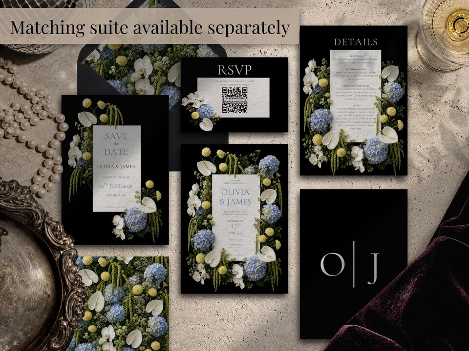 An arrangement of matching wedding stationery items including save the date, RSVP, details cards, and envelopes.