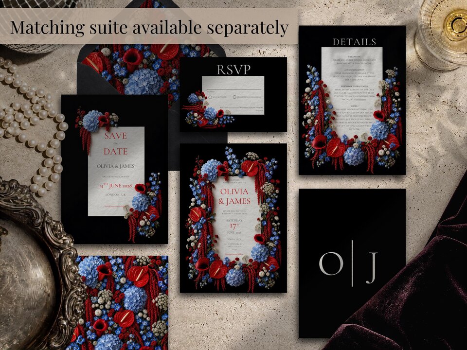 A flat lay showcasing a full suite of wedding stationery with dark backgrounds, red and blue floral accents, and matching envelopes.