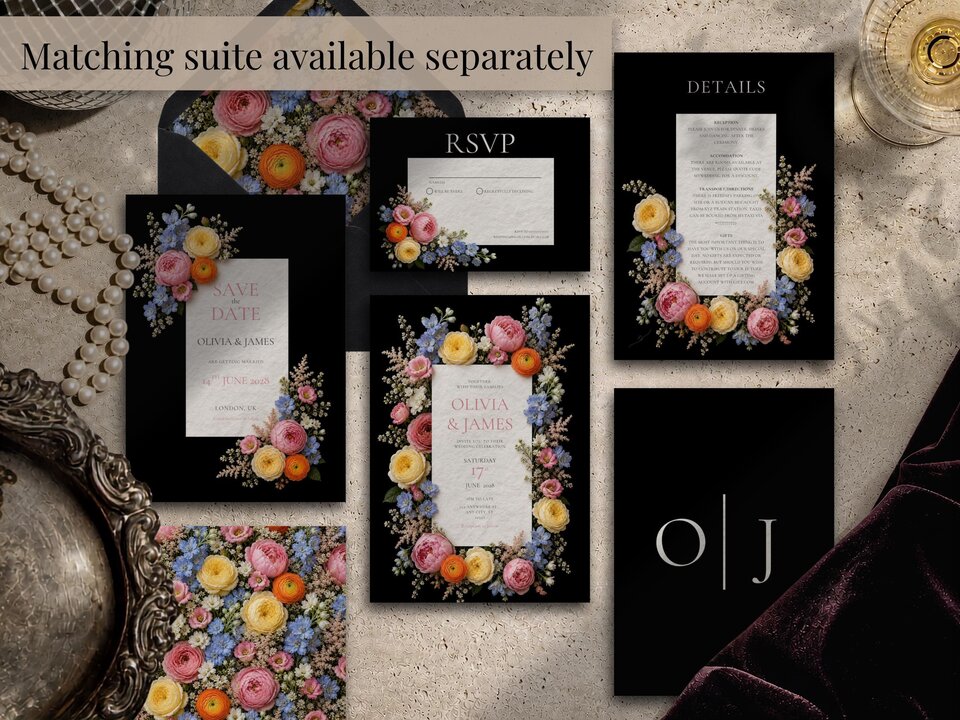 A flat lay of a complete wedding invitation suite on a black background decorated with pink, yellow, and blue wildflowers.