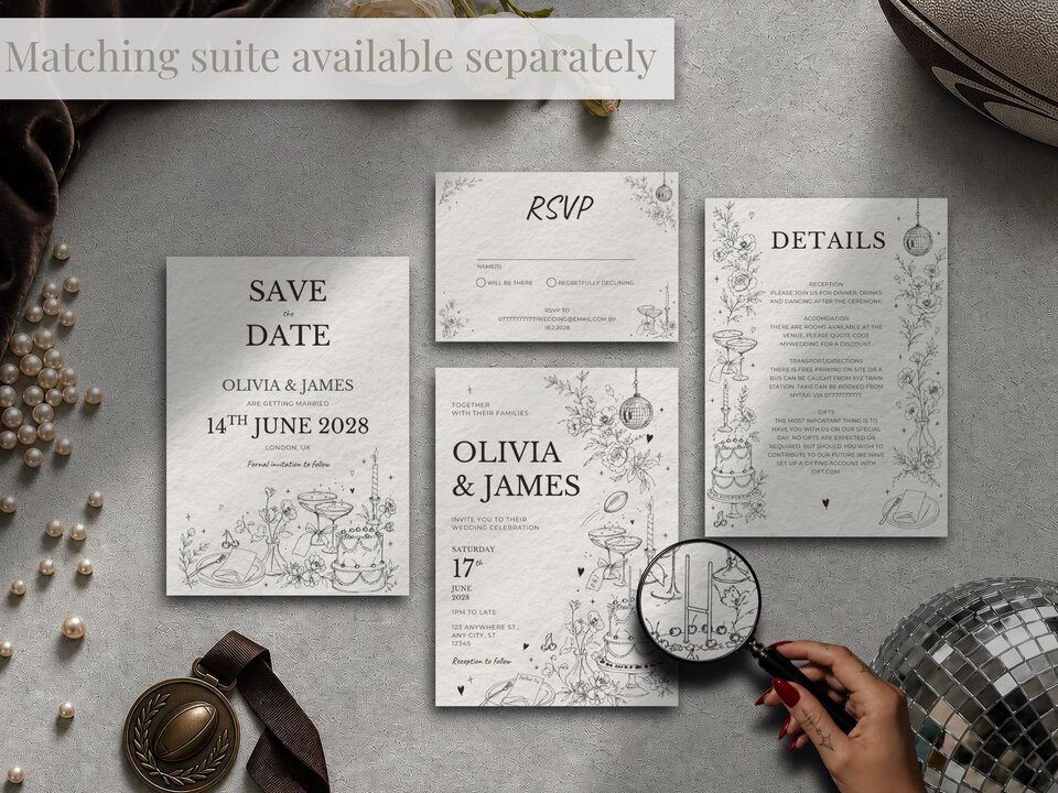 Several wedding stationery items including a save-the-date, RSVP cards, and details cards are arranged on a grey surface with a magnifying glass.