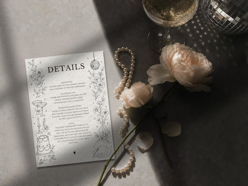 A wedding details card featuring text and line illustrations, styled with a string of pearls, two pale pink roses, a glass of champagne, and a disco ball.