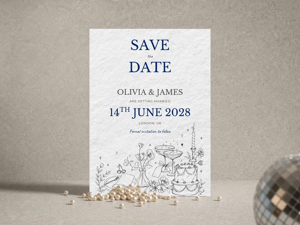 A Save the Date wedding card with blue text reading Save the Date Olivia and James on 14th June 2028, flanked by a string of pearls and a disco ball.