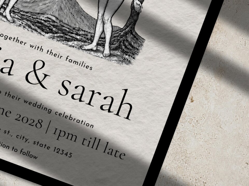 A close up view of the tarot themed wedding invitation showing the names olivia and sarah.