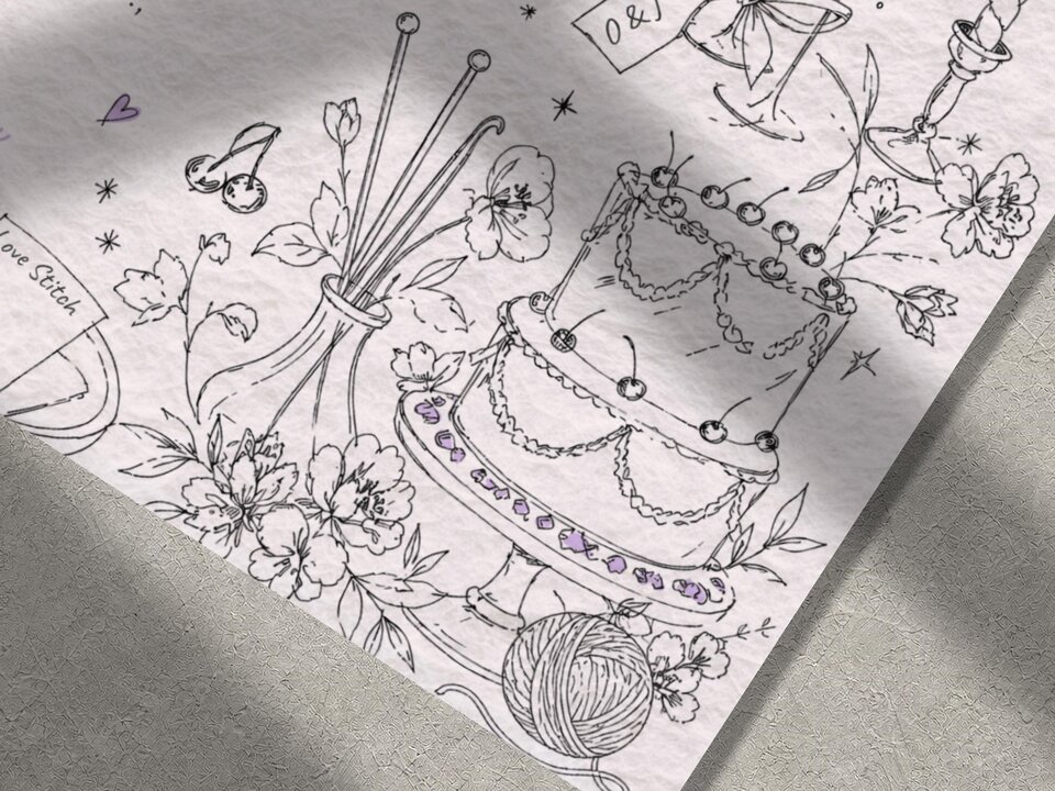 A close-up of the line art illustration on the wedding invitation, featuring a tiered cake with cherries, flowers, and knitting needles in a vase.