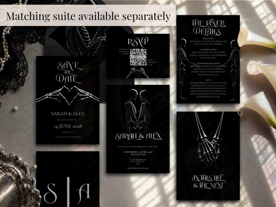 A flat lay showcasing multiple black wedding stationery items including invitations, RSVP cards, and details cards.