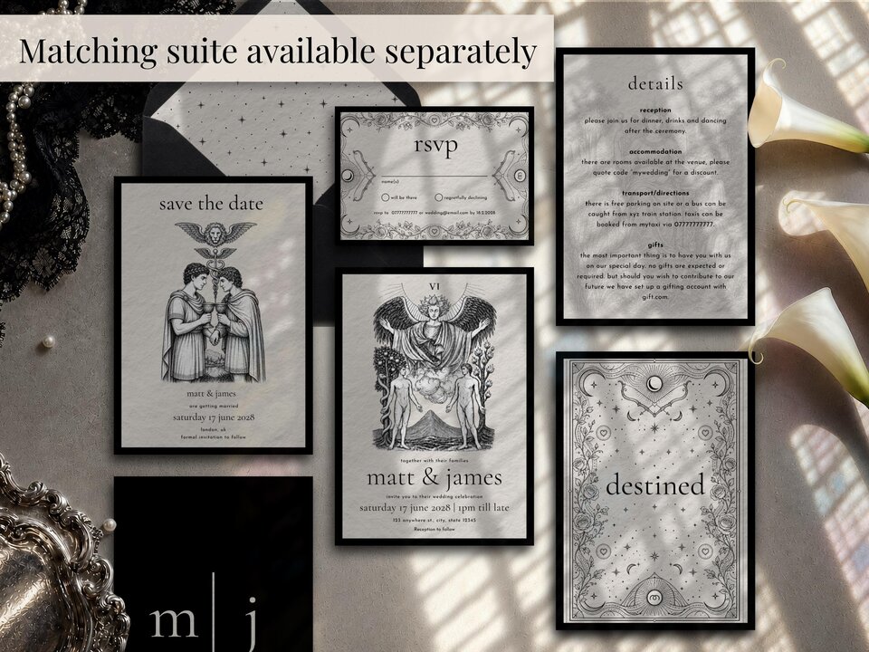A flat lay showcasing a matching suite of wedding stationery items including invitations, RSVP cards, and details cards.
